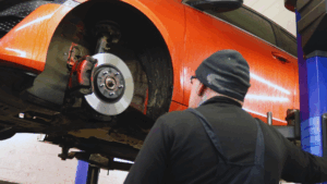Image of a car being worked on in a workshop.