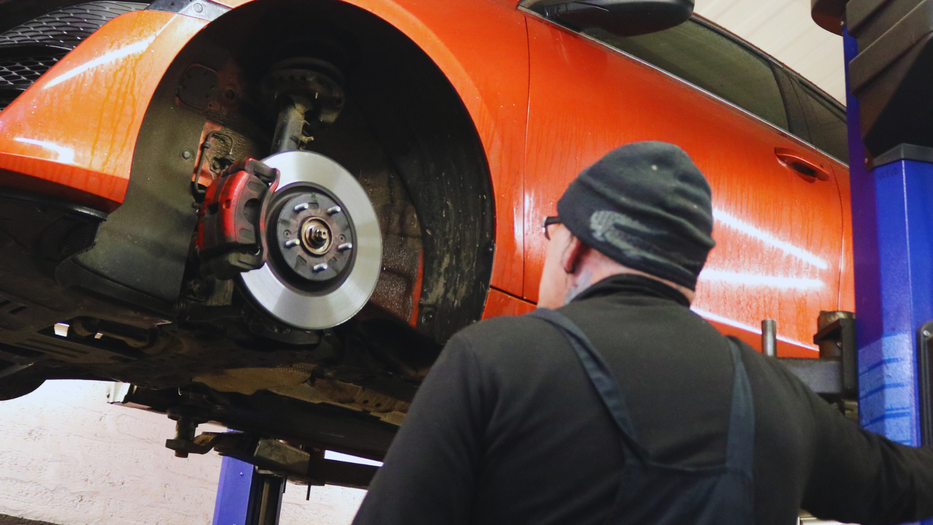 Image of a car being worked on in a workshop.